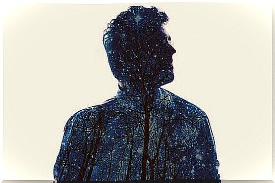 Man's body with forest and starry sky