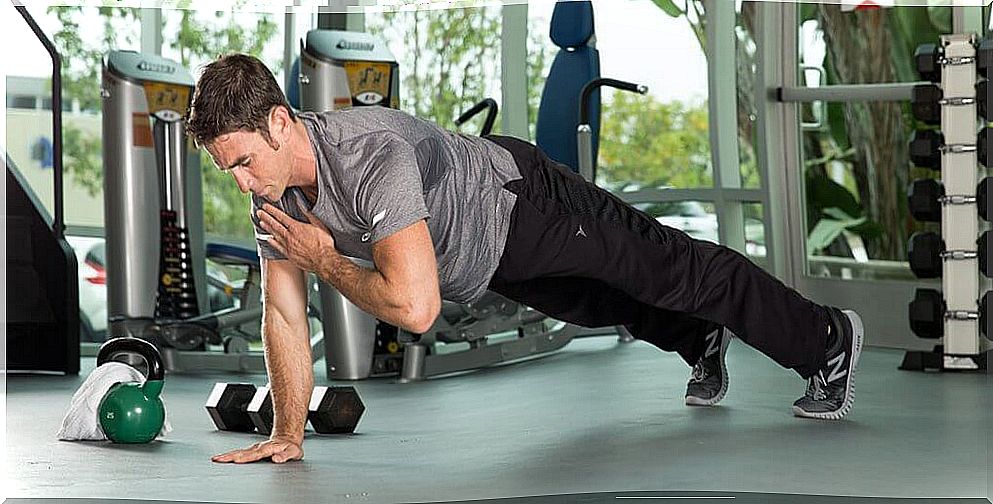 man doing exercises in the gym