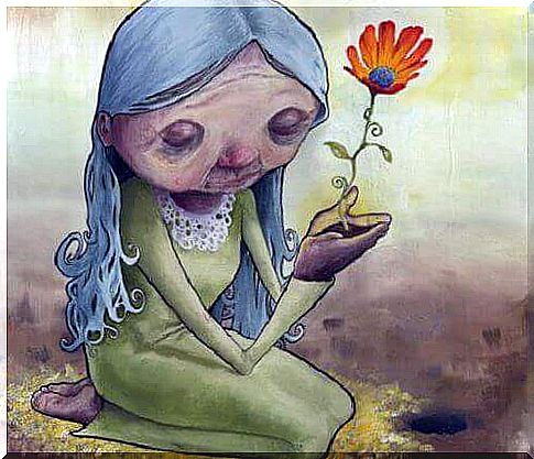 old lady holding flower