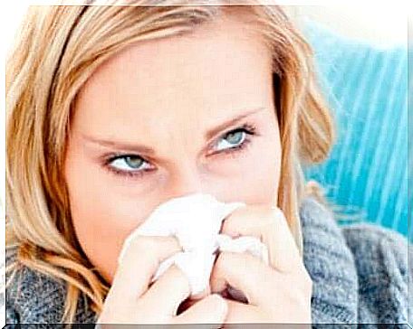 sneezing woman with handkerchief