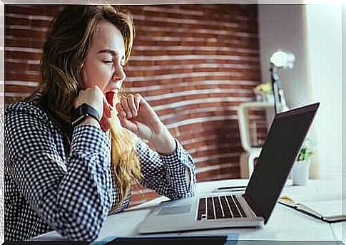 woman yawning at work