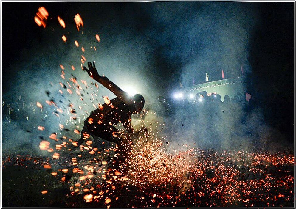 man walking on embers