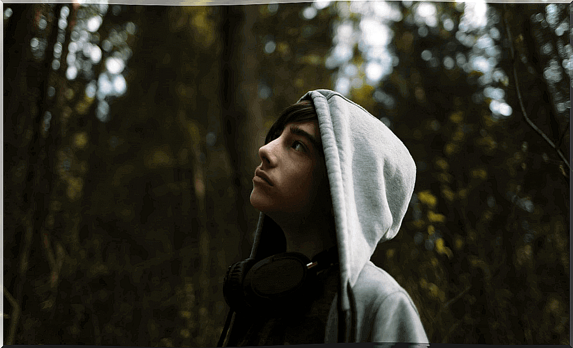 teen boy in the middle of nature