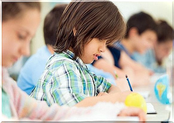 children writing at school