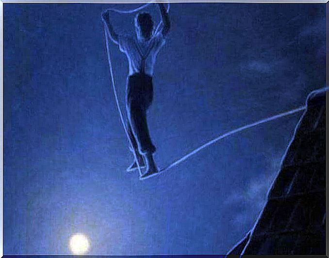 man walking a tightrope