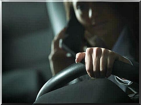 woman driving talking on cell phone