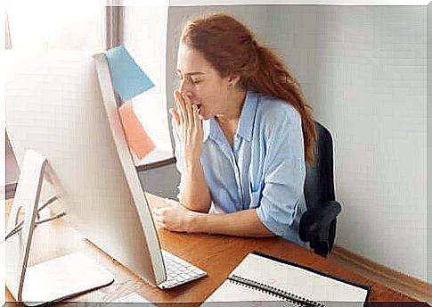 woman working sleepily