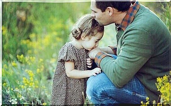 father being affectionate with his daughter